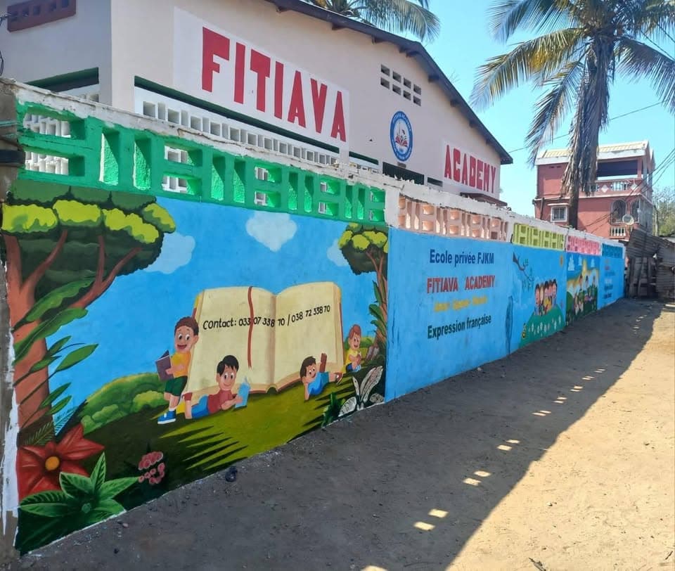 The colorful exterior of Fitiava Academy in Toliara