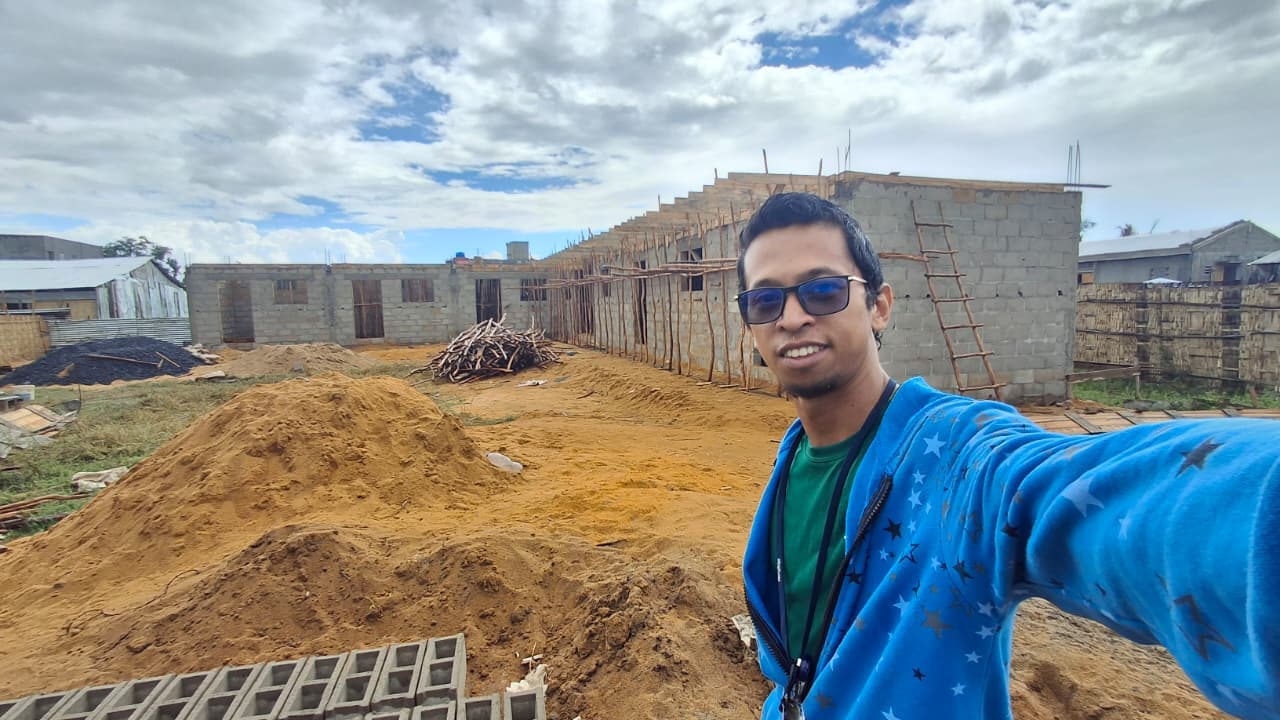 AMI team member at the school construction site